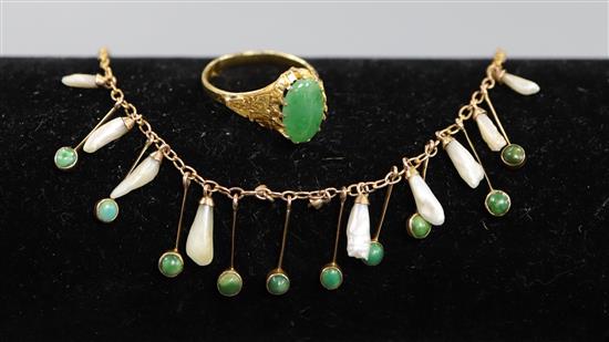 A Chinese yellow metal and jade ring, size L and a delicate gold mother of pearl and turquoise fringe necklace